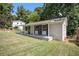 White brick ranch house with covered porch and large backyard at 4218 Tara Dr, Forest Park, GA 30297