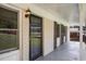 Inviting front porch with brick exterior and dark shutters at 4218 Tara Dr, Forest Park, GA 30297