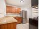 Modern kitchen with stainless steel appliances and wood cabinets at 4218 Tara Dr, Forest Park, GA 30297