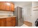 Kitchen with stainless steel appliances and wood cabinets at 4218 Tara Dr, Forest Park, GA 30297