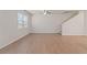 Hardwood floor living room with window and staircase at 7016 Fringe Flower Dr # 88, Austell, GA 30168