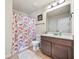 Bathroom with shower, vanity, and toilet at 560 Besra Dr, Grayson, GA 30017