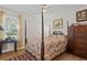 Bedroom with a four-poster bed and wooden dresser at , Locust Grove, GA 30248