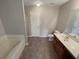 Bathroom with tub, toilet and vanity at 2491 Emma Way, Lawrenceville, GA 30044