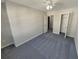 Spacious bedroom with gray carpet and double door closet at 2491 Emma Way, Lawrenceville, GA 30044