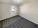 Spacious bedroom with gray carpet and exterior access at 2491 Emma Way, Lawrenceville, GA 30044