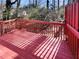 Red stained wooden deck overlooking a wooded area at 2491 Emma Way, Lawrenceville, GA 30044