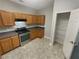 Kitchen with stainless steel appliances and pantry at 2491 Emma Way, Lawrenceville, GA 30044