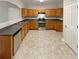 Kitchen with stainless steel appliances and wood cabinets at 2491 Emma Way, Lawrenceville, GA 30044
