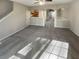 Spacious living room with kitchen and hallway views at 2491 Emma Way, Lawrenceville, GA 30044