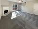 Living room with fireplace and carpet flooring at 2491 Emma Way, Lawrenceville, GA 30044
