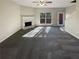 Bright living room with fireplace and carpet flooring at 2491 Emma Way, Lawrenceville, GA 30044