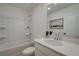 Clean bathroom with a shower/tub combo, white vanity, and a large mirror at 401 Carrera Ln, Acworth, GA 30102