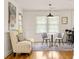 Bright dining area featuring a modern sofa and round table at 417 Lynnhaven Sw Dr, Atlanta, GA 30310