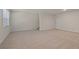 Unfinished basement with carpeted floor and staircase at 7000 Fringe Flower Dr # 85, Austell, GA 30168