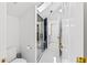 Elegant bathroom with a walk-in shower, marble flooring, and a separate toilet area at 117 N Cove Dr, Peachtree City, GA 30269