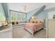 Serene bedroom featuring light walls, a window seat, and a plush bed at 117 N Cove Dr, Peachtree City, GA 30269