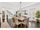 Elegant dining room features a large wood table and chandelier at 117 N Cove Dr, Peachtree City, GA 30269