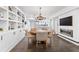 Elegant dining room with built-in shelving and chandelier at 117 N Cove Dr, Peachtree City, GA 30269
