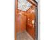 Modern home elevator showcasing wood-paneled interior and dark hardwood floors at 117 N Cove Dr, Peachtree City, GA 30269