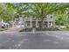 Two-story home with covered porch and landscaping at 117 N Cove Dr, Peachtree City, GA 30269