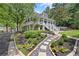 Two-story home with stone pathway and landscaping at 117 N Cove Dr, Peachtree City, GA 30269