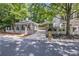 House with detached garage and gated driveway at 117 N Cove Dr, Peachtree City, GA 30269