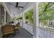 Spacious front porch with white columns and outdoor seating at 117 N Cove Dr, Peachtree City, GA 30269