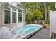 Modern hot tub on deck with sunroom view at 117 N Cove Dr, Peachtree City, GA 30269