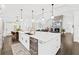 Spacious kitchen boasts a large island and high-end appliances at 117 N Cove Dr, Peachtree City, GA 30269
