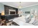 Main bedroom with built-in media console and ensuite bath at 117 N Cove Dr, Peachtree City, GA 30269