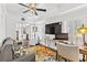 Home office with hardwood floors, built-ins, and a view into another room at 117 N Cove Dr, Peachtree City, GA 30269