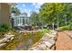 Serene pond with brick pathway and surrounding greenery at 117 N Cove Dr, Peachtree City, GA 30269