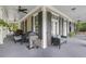 Large porch with built-in grill and comfortable seating at 117 N Cove Dr, Peachtree City, GA 30269