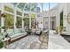 Bright sunroom features a wet bar, comfortable seating, and patterned tile floor at 117 N Cove Dr, Peachtree City, GA 30269