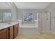 Bathroom with a soaking tub, shower, and double vanity at 1762 Caswell Pkwy # 33, Marietta, GA 30060