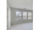 Bright bedroom with three windows and neutral wall paint at 1762 Caswell Pkwy # 33, Marietta, GA 30060