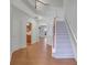 Two-story entryway with hardwood floors and an open staircase at 1762 Caswell Pkwy # 33, Marietta, GA 30060
