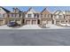 Row of townhouses featuring two-car garages and attractive street appeal at 1762 Caswell Pkwy # 33, Marietta, GA 30060