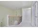 Upstairs hallway with chandelier, neutral paint, and carpet at 1762 Caswell Pkwy # 33, Marietta, GA 30060