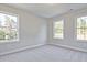 Bedroom with three windows and neutral decor at 221 Admor Ln, Acworth, GA 30102