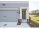 Gray siding house with gray door and attached garage at 221 Admor Ln, Acworth, GA 30102