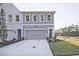 Townhouse with grey siding and a two-car garage at 221 Admor Ln, Acworth, GA 30102