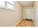 Neutral-toned entryway with hardwood floors and a door to the outside at 1833 Tommy Lee Cook Rd, Palmetto, GA 30268