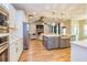 Open concept kitchen overlooking living room with hardwood floors at 1833 Tommy Lee Cook Rd, Palmetto, GA 30268