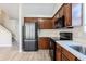 Modern kitchen with stainless steel appliances and light countertops at 3855 Cedar Trace Ct, Ellenwood, GA 30294