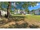 Large backyard with mature trees and a grassy area at 815 Windy Mill Ct, Temple, GA 30179