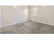 Bright bedroom featuring a window and neutral wall-to-wall carpet at , Fayetteville, GA 30214