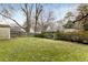 Large backyard with a wooden fence at 3027 Saint Annes Nw Ln, Atlanta, GA 30327