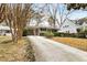 Long driveway leading to a ranch home at 3027 Saint Annes Nw Ln, Atlanta, GA 30327